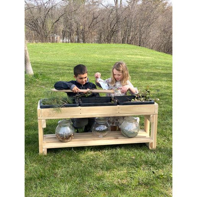 Three-compartment outdoor sensory table for day-care centers
